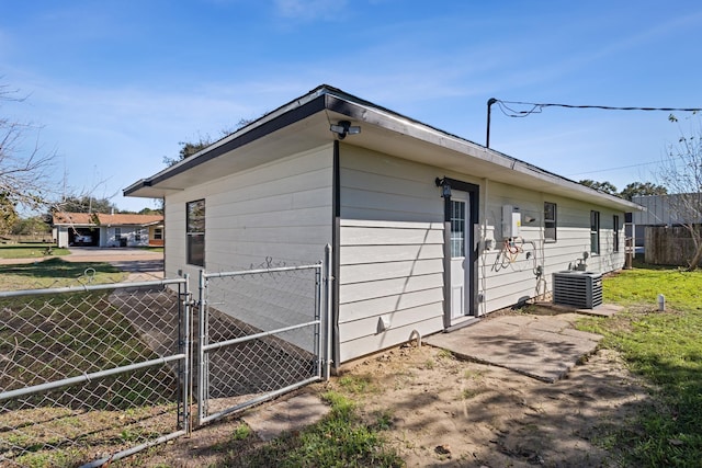 6259 Pat Ave, Port Arthur, TX 77640 - view of side of property with a central AC unit and a gate