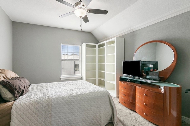 bedroom with carpet flooring, vaulted ceiling, and ceiling fan