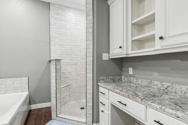 bathroom featuring vanity, wood-type flooring, and independent shower and bath