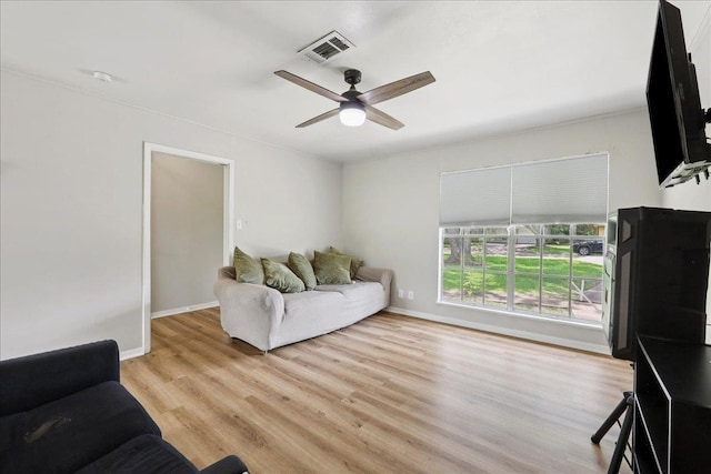 5150 Stardust Dr, Beaumont, TX 77706 - living area with a ceiling fan and light wood-style floors