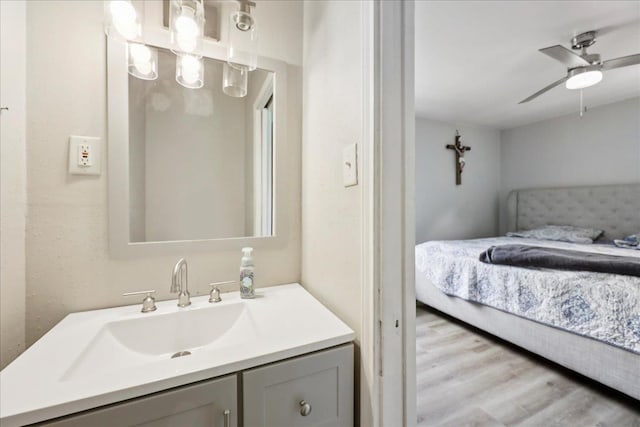5150 Stardust Dr, Beaumont, TX 77706 - bathroom featuring ensuite bath, vanity, wood finished floors, and a ceiling fan