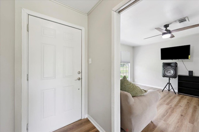 5150 Stardust Dr, Beaumont, TX 77706 - foyer entrance with wood finished floors, ceiling fan, and crown molding