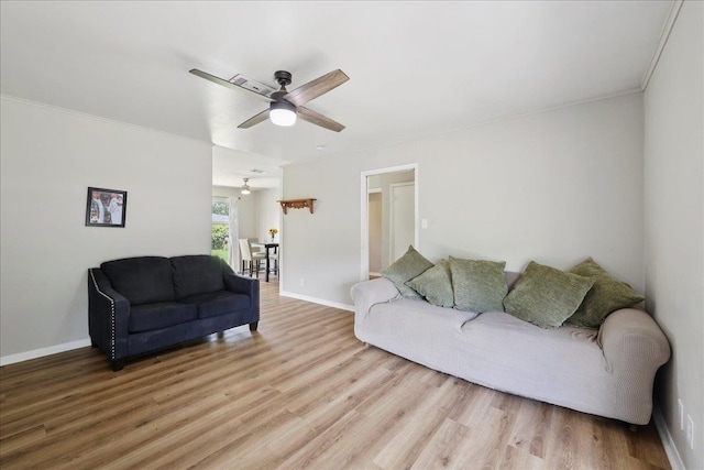 5150 Stardust Dr, Beaumont, TX 77706 - living room with a ceiling fan, light wood-type flooring, and crown molding