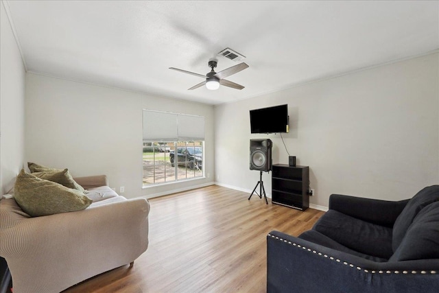 5150 Stardust Dr, Beaumont, TX 77706 - living area featuring a ceiling fan, wood finished floors, and ornamental molding