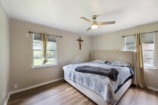 5150 Stardust Dr, Beaumont, TX 77706 - bedroom featuring multiple windows, wood finished floors, and ceiling fan