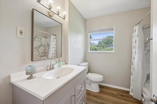 5150 Stardust Dr, Beaumont, TX 77706 - bathroom with vanity, wood finished floors, and a shower with shower curtain