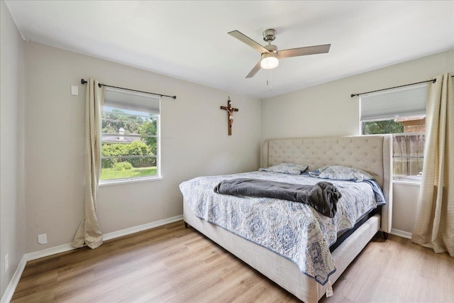 5150 Stardust Dr, Beaumont, TX 77706 - bedroom with multiple windows, wood finished floors, and ceiling fan
