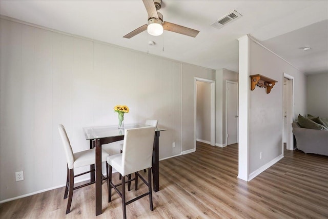 5150 Stardust Dr, Beaumont, TX 77706 - dining area featuring a ceiling fan, wood finished floors, and crown molding