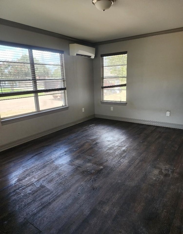 empty room with a wall mounted air conditioner, dark hardwood / wood-style flooring, and ornamental molding