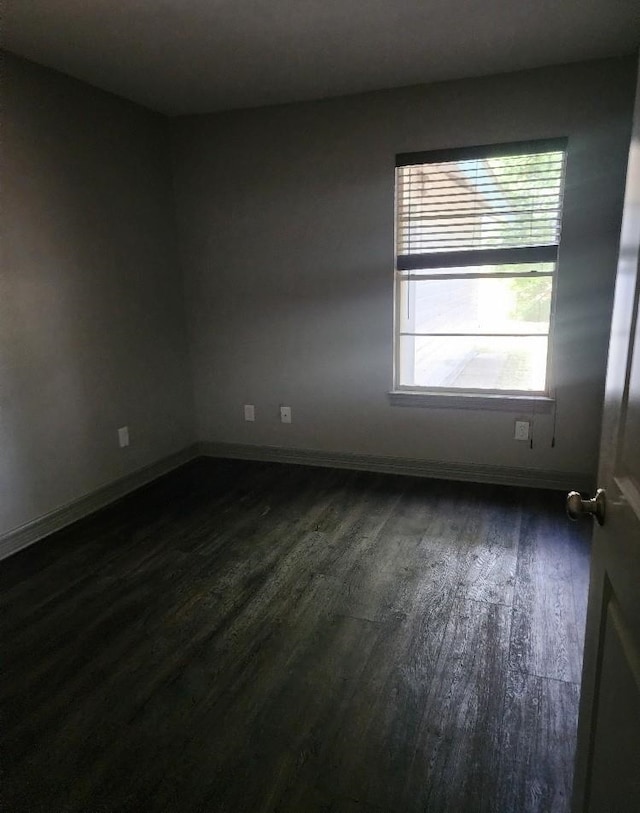 empty room featuring dark hardwood / wood-style floors