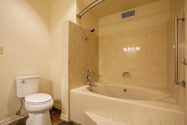 bathroom featuring toilet and tub / shower combination