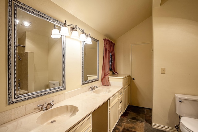 full bathroom featuring vanity, tub / shower combination, lofted ceiling, and toilet