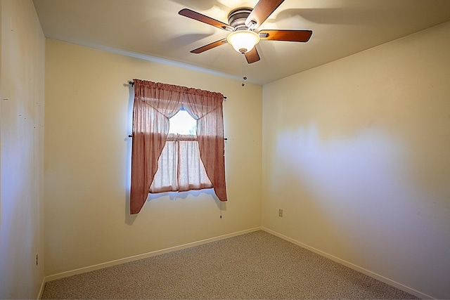 spare room with carpet flooring and ceiling fan