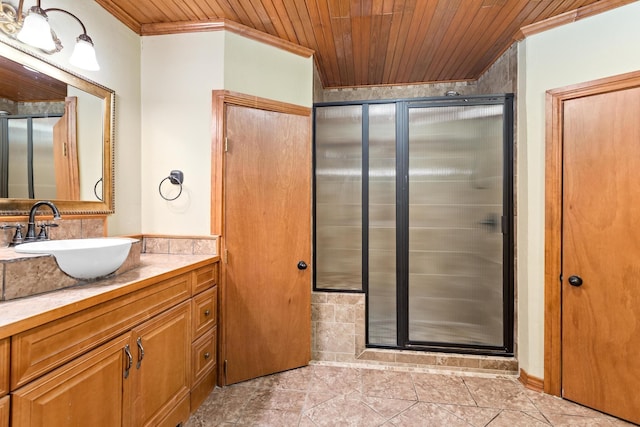 bathroom featuring vanity, walk in shower, crown molding, and wood ceiling