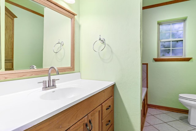 bathroom featuring tile patterned flooring, vanity, and toilet