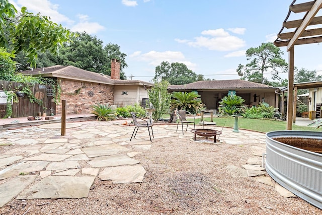 view of patio / terrace featuring a fire pit