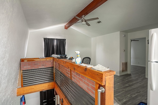 bar featuring white refrigerator, dark hardwood / wood-style floors, ceiling fan, and lofted ceiling with beams