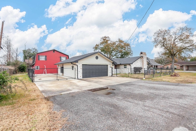 view of front of house featuring a garage and a front yard