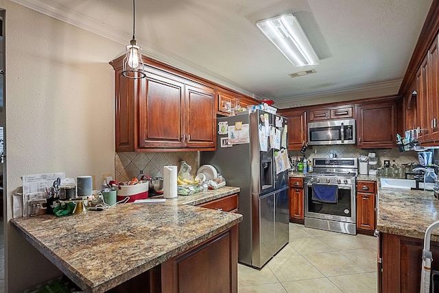 kitchen with sink, crown molding, light tile patterned floors, appliances with stainless steel finishes, and kitchen peninsula