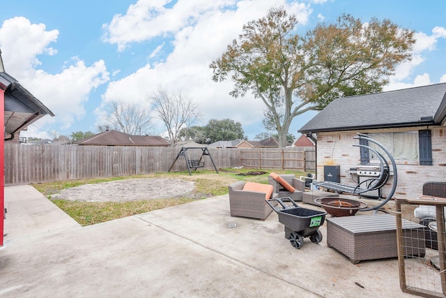 view of patio / terrace with a fire pit