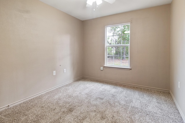 carpeted empty room with ceiling fan