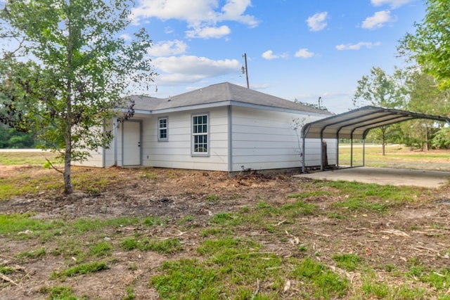 view of property exterior with a carport