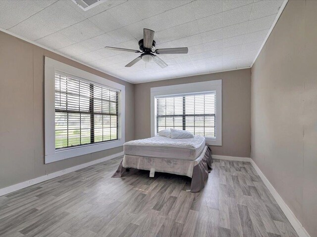 bedroom featuring ceiling fan and light wood-type flooring