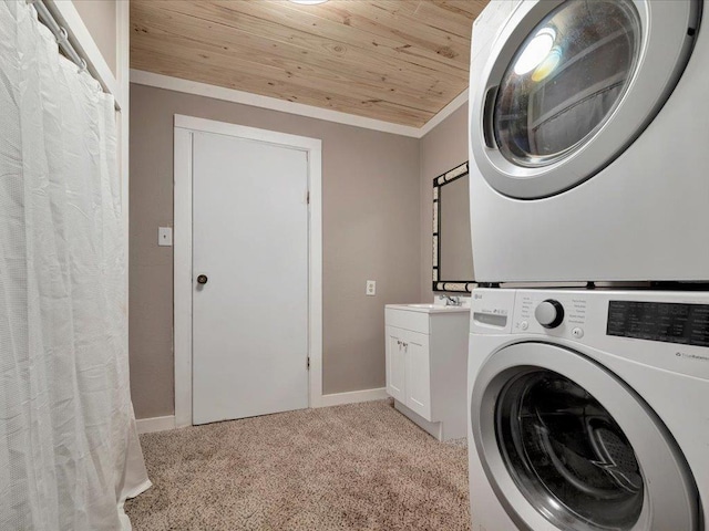 laundry area with light carpet, cabinets, wood ceiling, crown molding, and stacked washer / drying machine