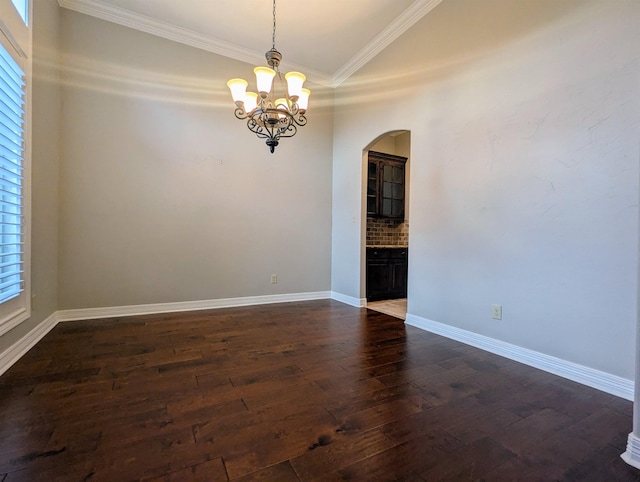 416 Birch View Dr, Lumberton, TX 77657 - unfurnished room with arched walkways, crown molding, dark wood-type flooring, a chandelier, and baseboards