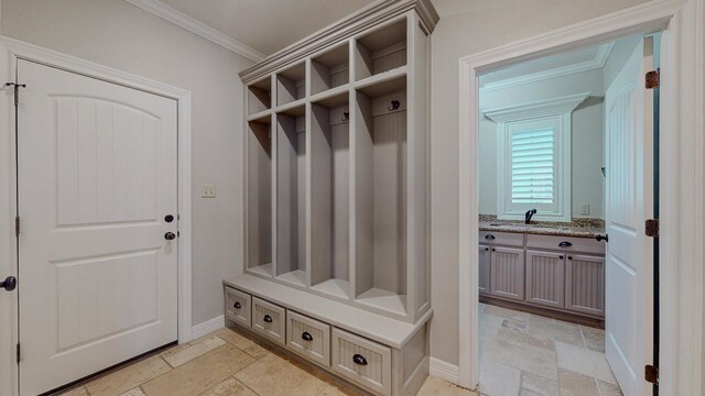 416 Birch View Dr, Lumberton, TX 77657 - mudroom with stone tile floors, ornamental molding, baseboards, and a sink