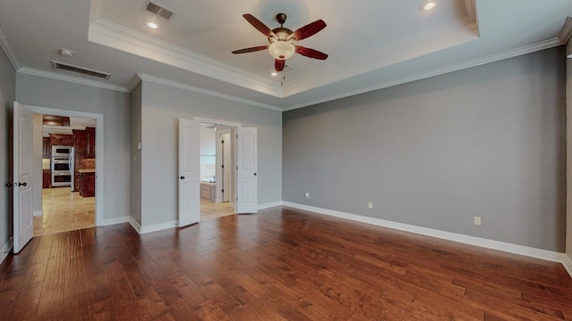 416 Birch View Dr, Lumberton, TX 77657 - empty room featuring a tray ceiling, ceiling fan, dark wood finished floors, baseboards, and ornamental molding