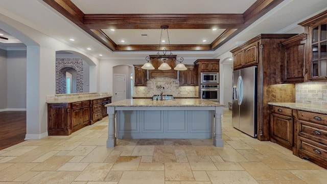416 Birch View Dr, Lumberton, TX 77657 - kitchen with stainless steel appliances, arched walkways, backsplash, and light stone countertops