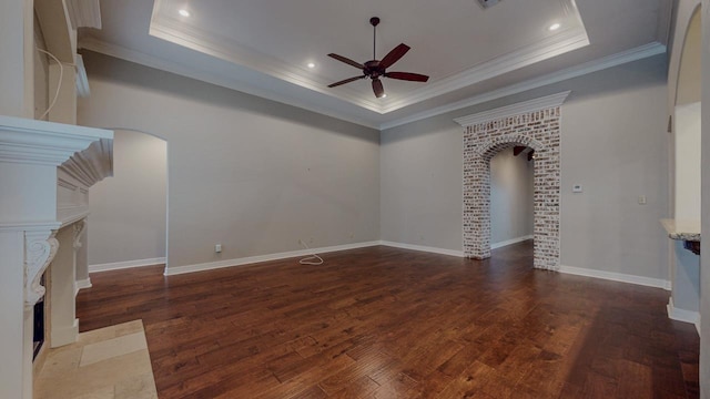 416 Birch View Dr, Lumberton, TX 77657 - unfurnished living room with a raised ceiling, arched walkways, ceiling fan, crown molding, and hardwood / wood-style floors