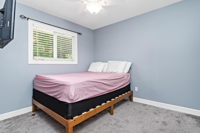 12945 Westchester Ln, Beaumont, TX 77713 - bedroom with carpet floors, baseboards, and a ceiling fan
