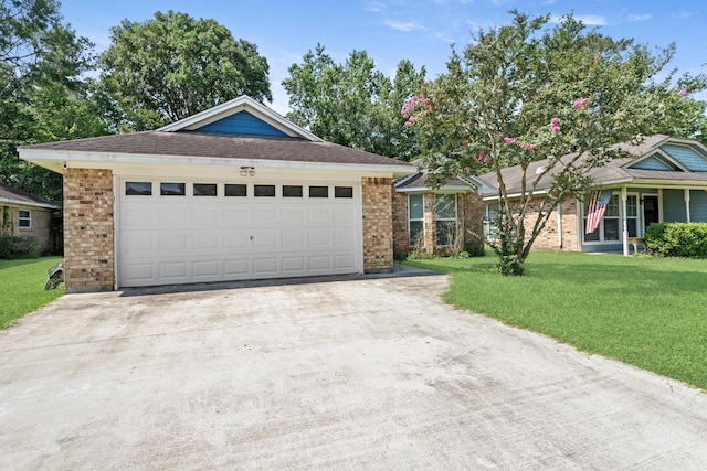 12945 Westchester Ln, Beaumont, TX 77713 - ranch-style home featuring driveway, brick siding, a front lawn, and a garage