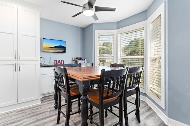 12945 Westchester Ln, Beaumont, TX 77713 - dining space featuring light wood-style flooring, ceiling fan, and baseboards