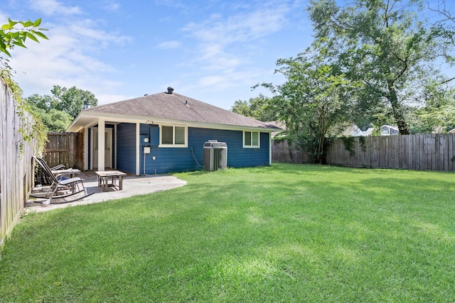 12945 Westchester Ln, Beaumont, TX 77713 - back of house featuring a patio, a shingled roof, and central air condition unit