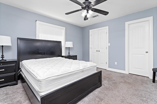 12945 Westchester Ln, Beaumont, TX 77713 - bedroom featuring carpet floors, a closet, baseboards, and a ceiling fan