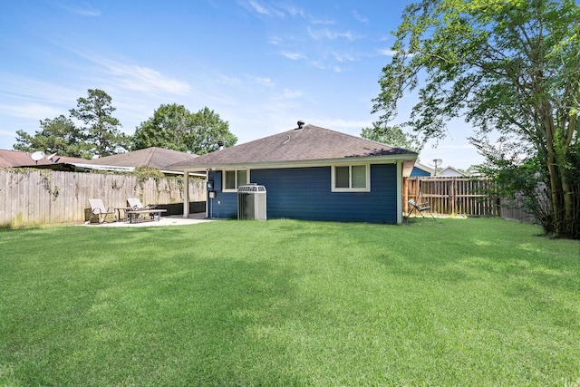 12945 Westchester Ln, Beaumont, TX 77713 - rear view of property with a patio and roof with shingles