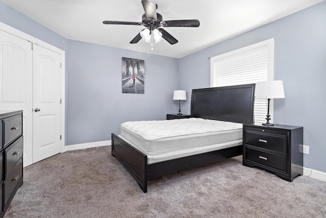 12945 Westchester Ln, Beaumont, TX 77713 - carpeted bedroom with baseboards and ceiling fan