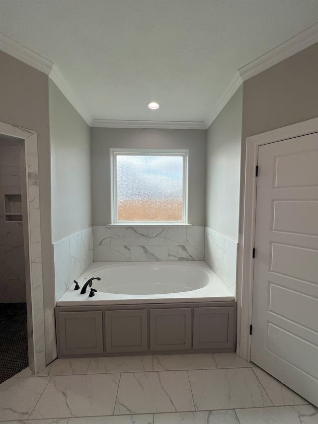 full bath with marble finish floor, ornamental molding, and a bath