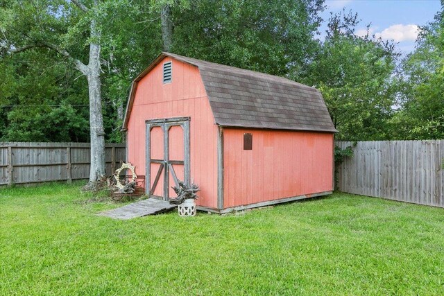 view of outdoor structure with a lawn