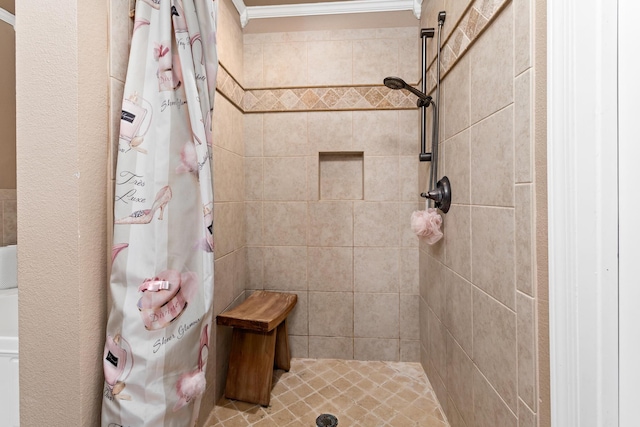 bathroom featuring a shower with curtain and ornamental molding