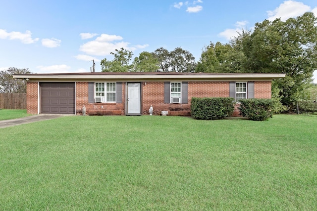 ranch-style home with a front yard and a garage