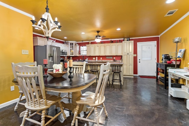 dining space featuring crown molding, sink, and ceiling fan with notable chandelier