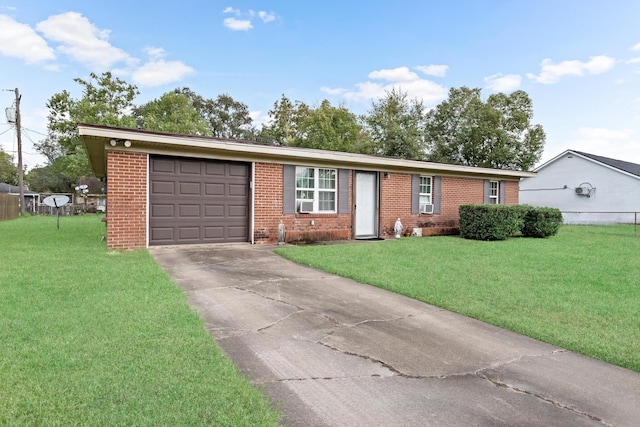 ranch-style home featuring a garage and a front yard