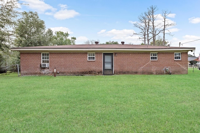 back of property with a yard and cooling unit