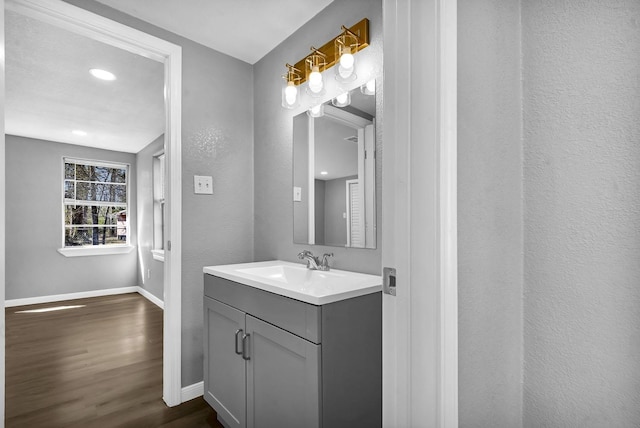 347 W Texas State Highway 63, Jasper, TX 75951 - bathroom with wood finished floors, baseboards, vanity, and recessed lighting