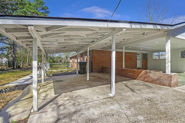 347 W Texas State Highway 63, Jasper, TX 75951 - view of patio featuring fence, an attached carport, and concrete driveway