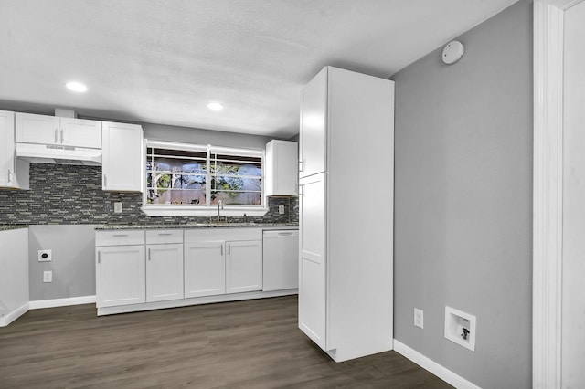 347 W Texas State Highway 63, Jasper, TX 75951 - kitchen with white dishwasher, a sink, white cabinets, backsplash, and baseboards